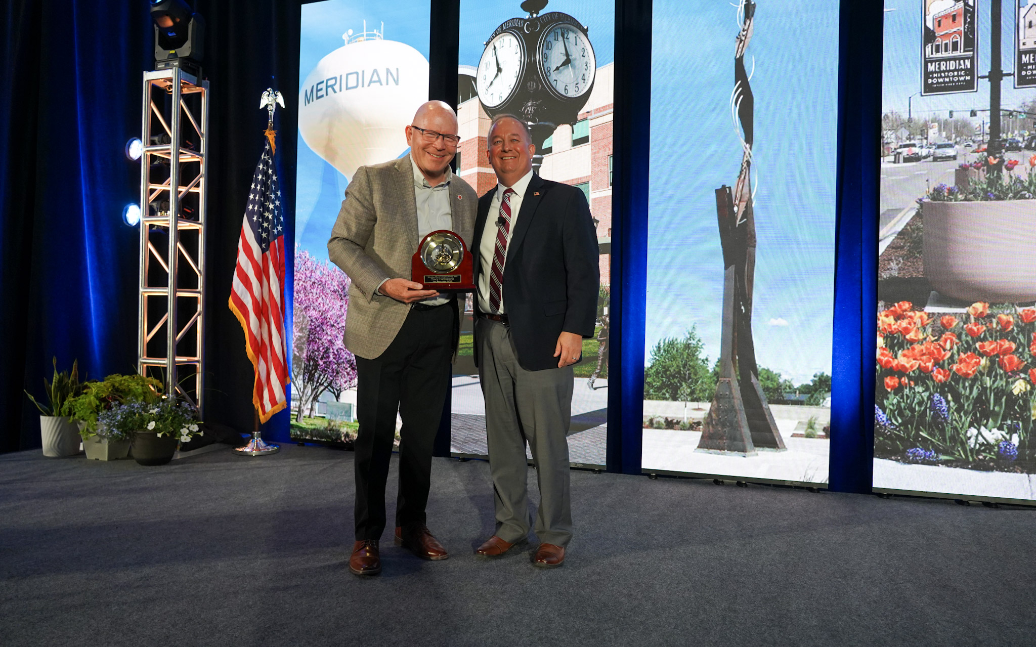 Mayor Robert Simison gives Dr. Tracy Farnworth, President of ICOM, the 2026 Meridian Legacy Award